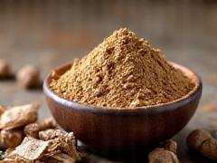 Maca root powder in a brown bowl.