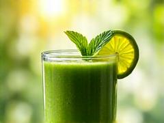 Vibrant green smoothie with fresh mint leaves for spring.